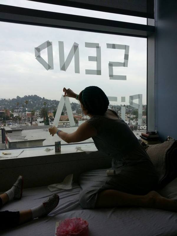 hazels mum putting up pizza sign