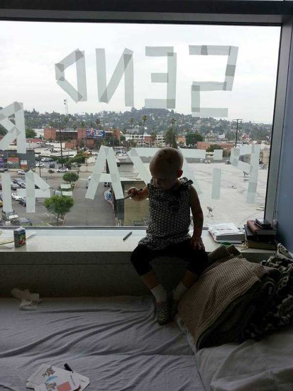 hazel putting up the pizza sign