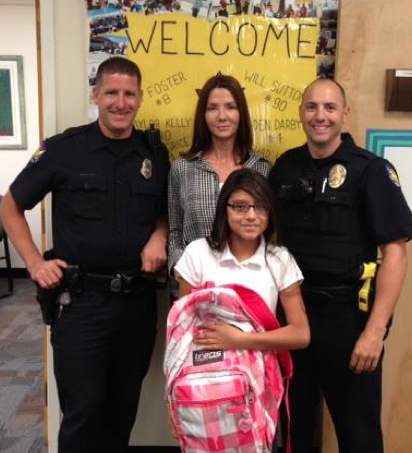 Policemen_with_school_girl_and_new_backpack