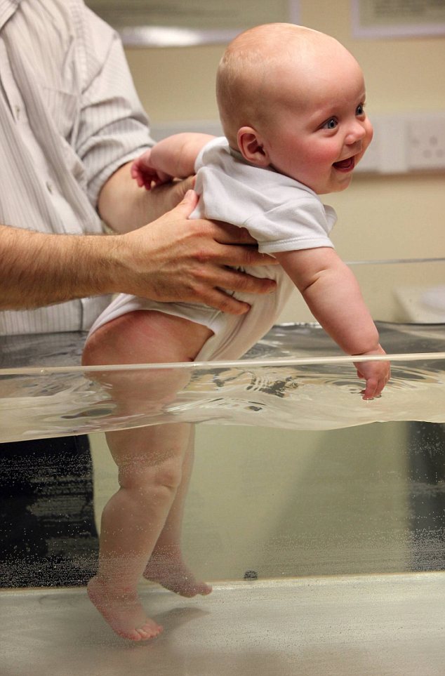 Child's play: 5 month old Ricky Kimber