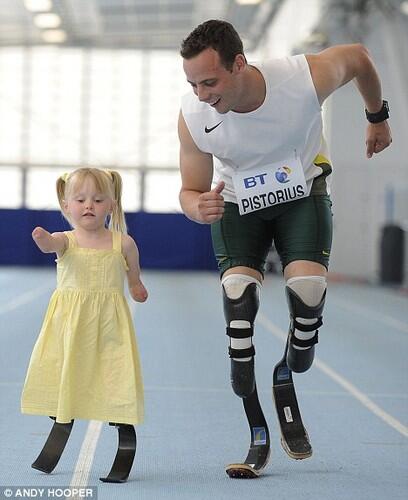 Oscar Pistorius training with a little girl