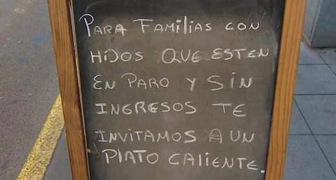 This is from a bar in Mallorca Spain, and it reads: for families with children, that are in strike and with no income, come in for a hot dinner...
