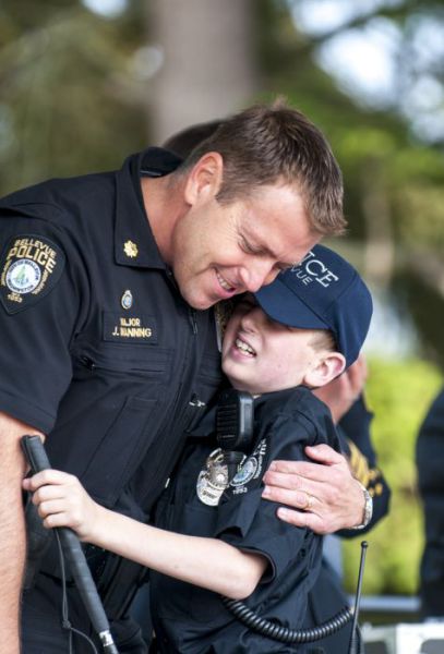 Gage Hancock hugging a policeman
