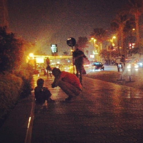 man kneeling down to talk to a homeless child - kindness