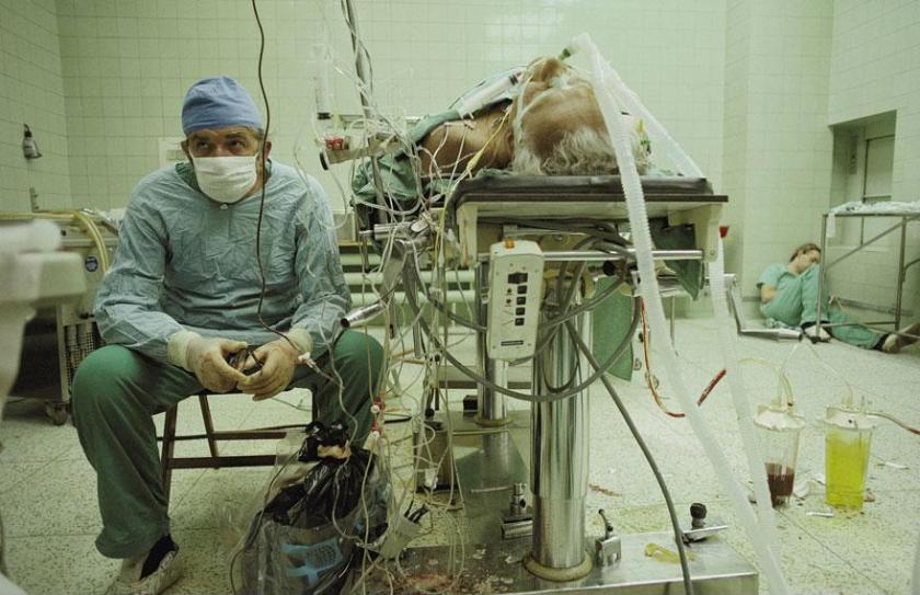 Dr. Zbigniew Religa tracking the vital signs of a heart-transplant patient. “I never let him out of my sight, never turned my back on him,” he says. “This was the payoff.” It was 1987, in an outmoded operating room in post-Soviet Poland.