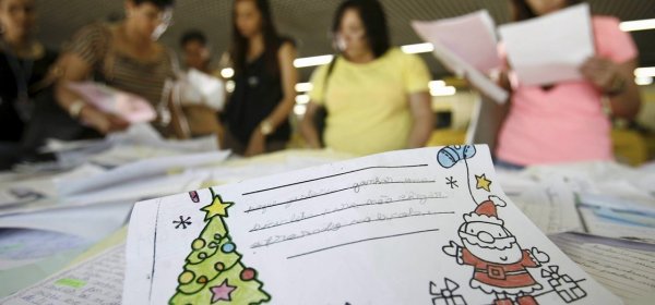 Volunteers look through children's letters to Santa at a post office in Salvador in northeastern Brazil's Bahia state. The campaign is part of a more than 20-year tradition to help those less fortunate to have gifts for the holiday.