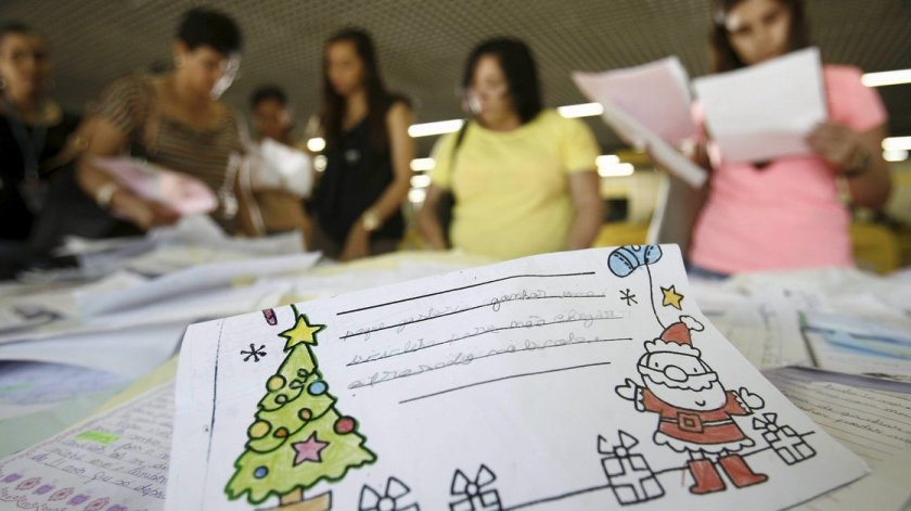 Volunteers look through children's letters to Santa at a post office in Salvador in northeastern Brazil's Bahia state. The campaign is part of a more than 20-year tradition to help those less fortunate to have gifts for the holiday.