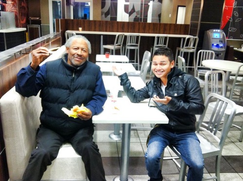 man and homeless man in mcdonalds