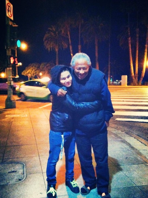 man and homeless man hugging