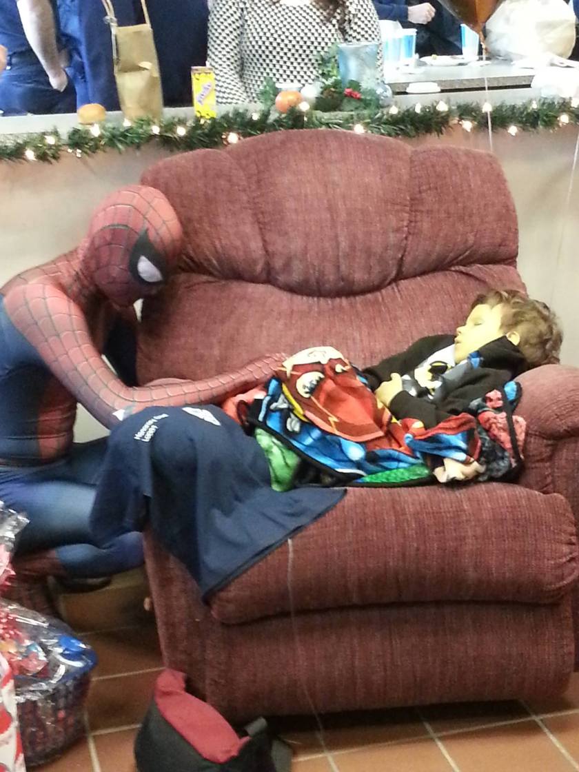  "He loved superheroes, firefighters, and had neuroblastoma. He began to decline rapidly and the firefighters threw him a party with Batman, Superman, and Spiderman. Spidey never left his side, not even for a second."