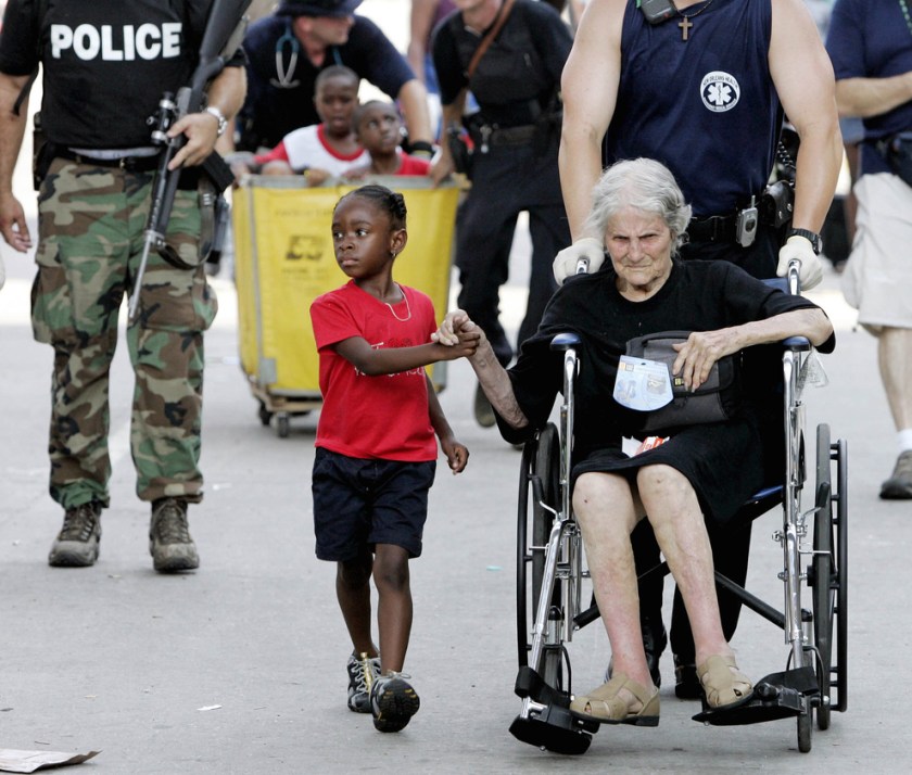  Tanisha Blevin, 5, holds the hand of fellow Hurricane Katrina victim Nita LaGarde, 105, as they are evacuated from the convention center in New Orleans