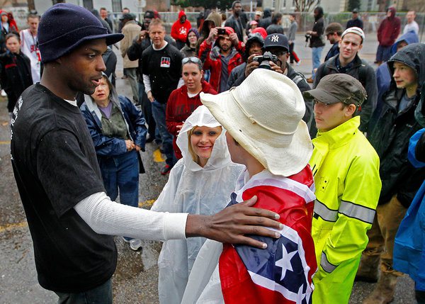 an African American minister, Shun Abram, confronting a Klu Klux Klan protestor calmly, strongly, and with peace, are so important. There are so many ways to fight, that to have heroes like this man is so essential for all of us. What an image.” Source: Charidy.com