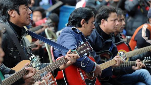 Musicians play John Lennon's "Imagine" in a memorial tribute to the 23-year old Indian gang rape victim, during a mass guitar ensemble played by some 600 guitarists in Darjeeling on January 3, 2013. Protesters have massed in Indian cities daily since the December 16 assault demanding the government and police take sex crime more seriously, with tougher penalties for offenders and even chemical castration being considered. Five men accused of gang-raping a 23-year-old student on a moving bus in New Delhi in a deadly crime that repulsed the nation are to be formally charged in court January 3. AFP PHOTO/Diptendu DUTTADIPTENDU DUTTA/AFP/Getty Images