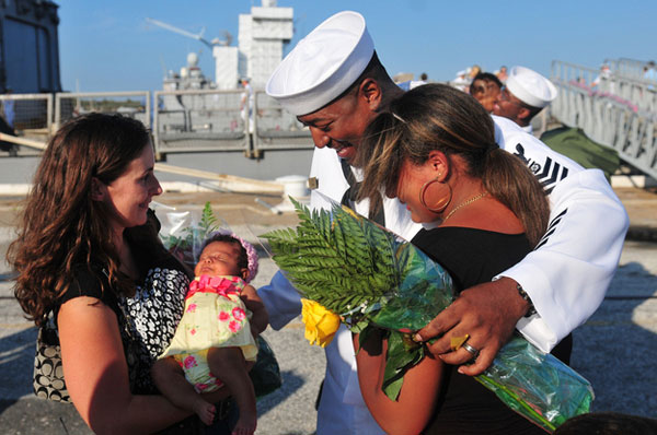  Sailor Kevin Limbrick meets his newborn daughter.