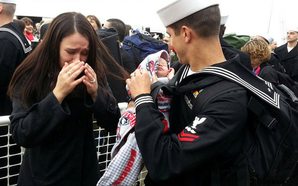 Sailor Steven Hart meets his infant child.