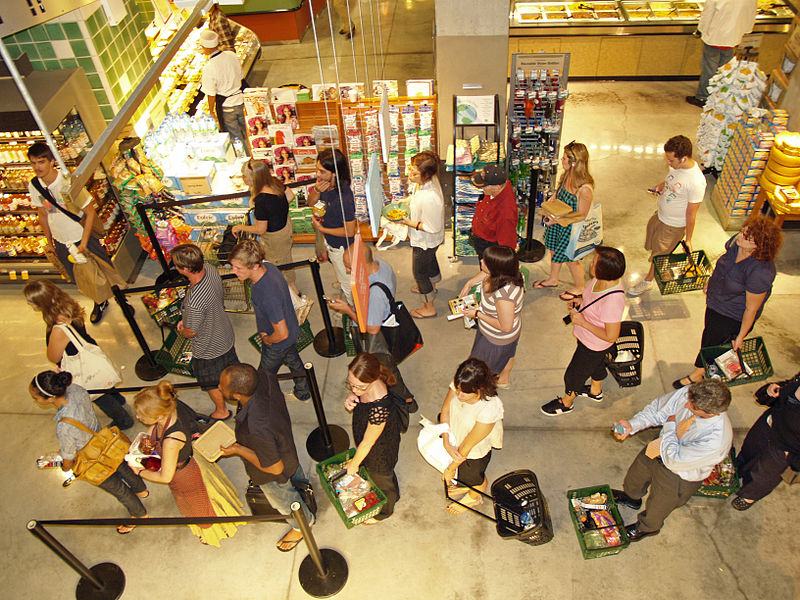 800px-Waiting_in_line_at_a_food_store
