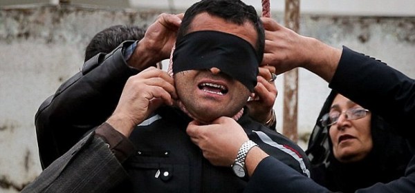 ncredible moment an Iranian killer is spared execution by his victim's mother