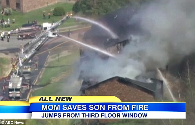 Selfless: Christina Simoes leaped from a second-floor balcony with her son Camron, right, in her arms  k