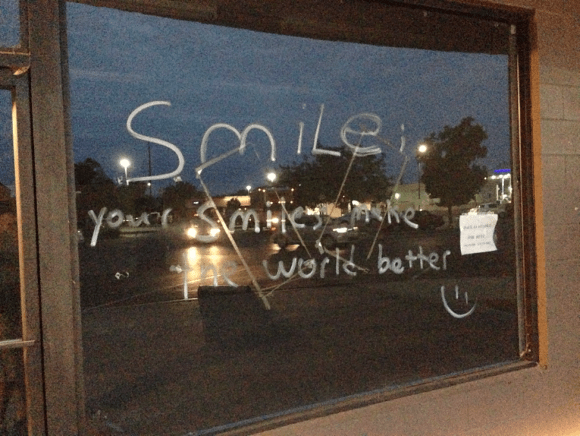 written on a window - smile