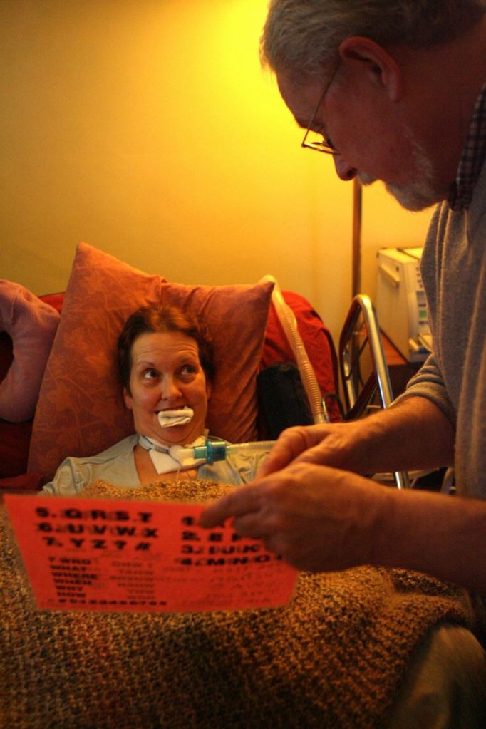 Lois V. Schultz((cq)) communicates with her husband Sam Ashworth((cq)) through letters, numbers and words on a sheet of paper. Lois((cq)) moves her eyes to let him know he is correct. Staff photo by Nick Daggy
