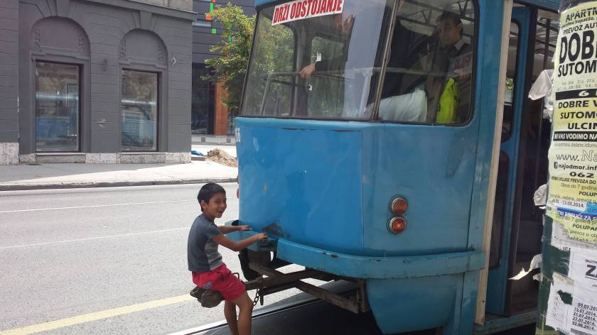 This little dude was snapped dude hitching a ride on the back of a tram. Sarajevo 2014.