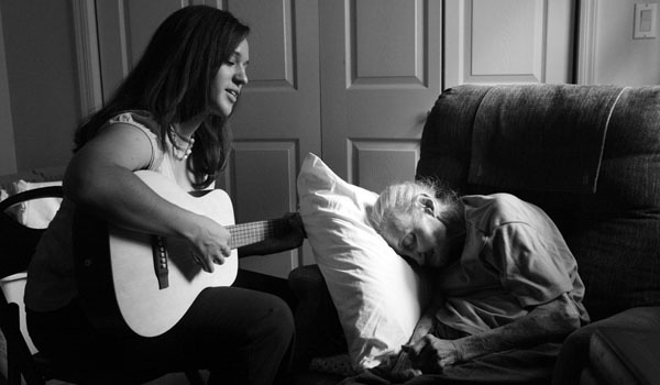 Rose Vuolo and her music therapist, Ms. Burton. "When Charla is playing," said her grandson, Paul Motisi, "my grandmother appears to be somewhat lucid. Her emotions go into a much more positive space."