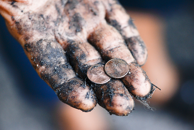 Rick Snyder showing pennies found