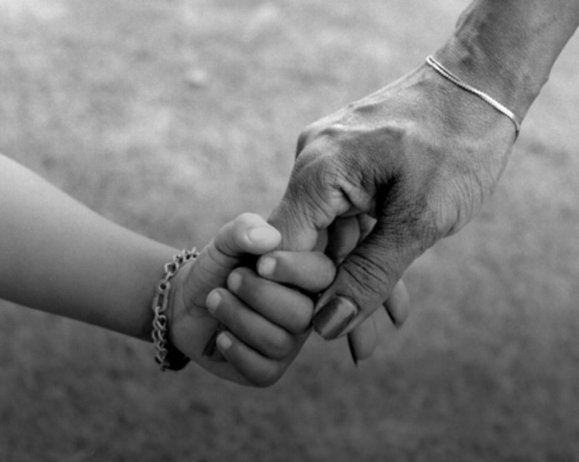 mother holding hands