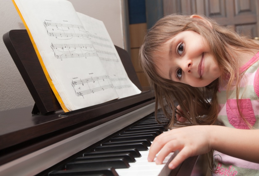 child playing a piano