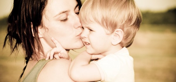 mother carrying her son