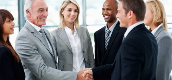 Business people shaking hands after successful negotiations