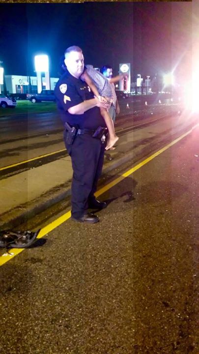 Police Officer Duke Staples Enters ‘Father Mode’ At Scene Of Car Crash, Photo Goes Viral Read more at http://www.inquisitr.com/2225441/baton-rouge-police-officer-duke-staples-enters-father-mode-at-scene-of-car-crash-photo-goes-viral/#y4erXqZzDwjzoLZ8.99
