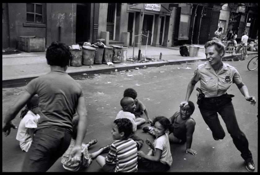 Police officers playing with children in Harlem, 1978