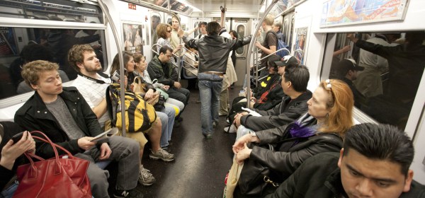 NYC Subway commuters ride the train