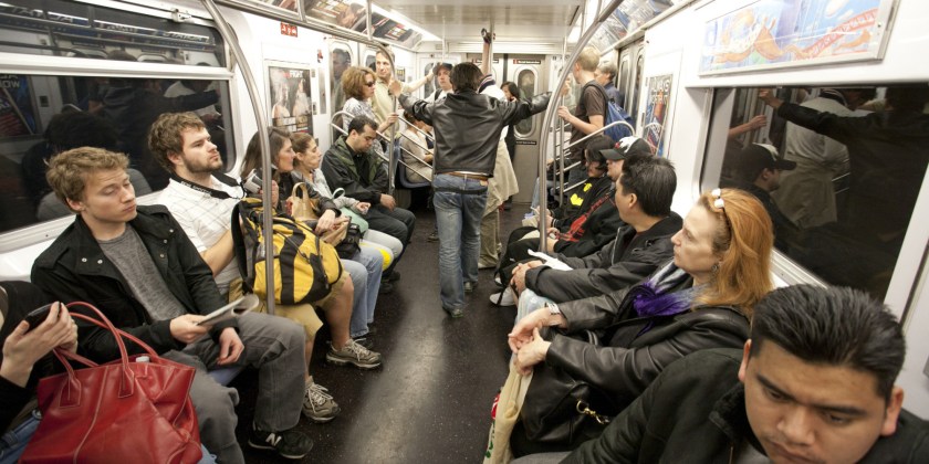 NYC Subway commuters ride the train