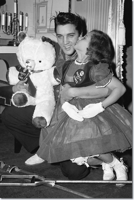 Elvis with a young polio patient 1958