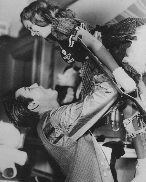Elvis with a young polio patient 1958