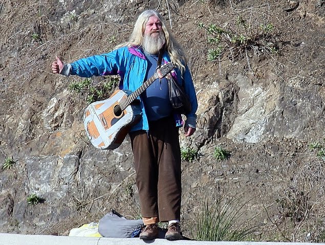 old man hitchhiking