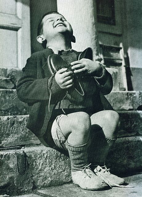 Austrian boy receives new shoes during WW2