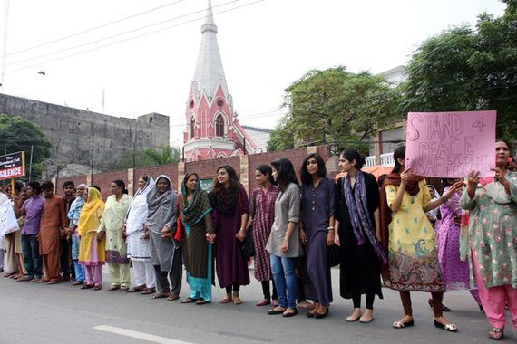 October 2013, Pakistan - Muslims form Human chain to protect Christians during Lahore mass