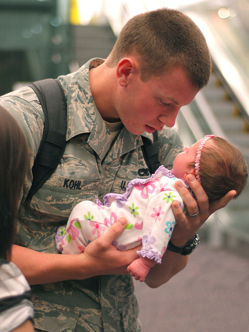 This picture was made two years ago when this US Marine saw his 3-week-old baby daughter for the first time. The young couple found out that they expecting a baby when this young guy was already away with his convoy. 